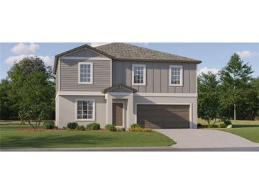 Charming two-story home with gray siding, lush landscaping, and attached two-car garage at 3711 Forest Path Dr, Plant City, FL 33565