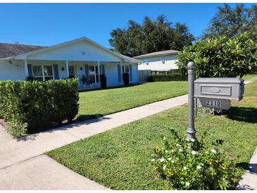 Charming single-story home with a well-manicured lawn and inviting curb appeal at 2310 Medford Ln, Brandon, FL 33511