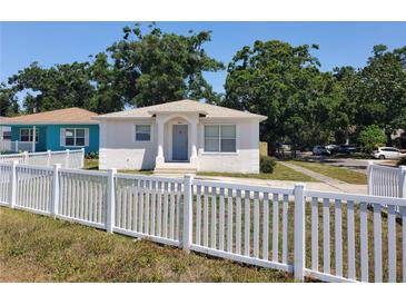 Charming single-story home featuring a white picket fence and well-maintained front yard at 4801 Haines N Rd, St Petersburg, FL 33714
