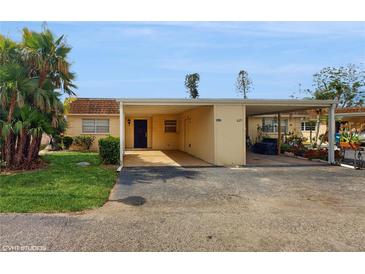 Charming single-story home with a covered carport and well-maintained landscaping at 623 Park Cir # 623, Bradenton, FL 34207