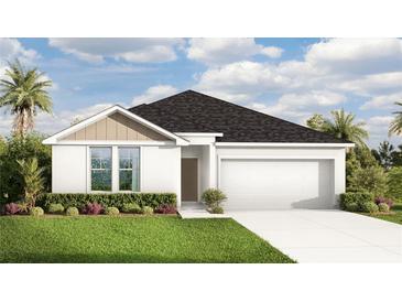 Charming single-story home featuring a two-car garage, well-manicured lawn, and welcoming front entrance at 3269 Reservoir St, North Port, FL 34288