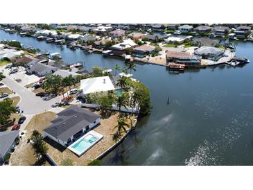 Waterfront property with a pool and boat dock, nestled in a beautiful canal community at 926 Eagle Ln, Apollo Beach, FL 33572