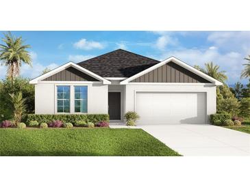 Charming one-story home with a well-manicured lawn and an attached two-car garage at 5133 Harbinger Rd, Spring Hill, FL 34608