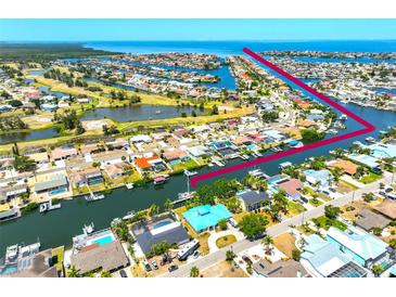 Beautiful waterfront community with canal access and various amenities including a pool and boat dock at 732 Kingston Ct, Apollo Beach, FL 33572