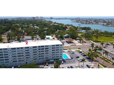 Condominium aerial view shows a building with a pool and a view of the bay at 7321 Central Ave # 503, St Petersburg, FL 33710