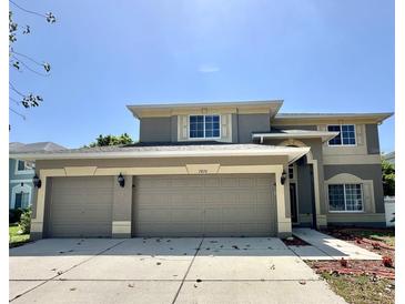 Charming two-story home with a three car garage and neutral color scheme at 2820 Pankaw Ln, Valrico, FL 33596