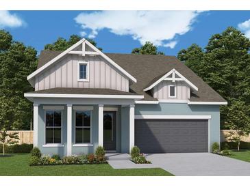 Charming single-Gathering home with professionally landscaped front yard and attached two-car garage at 5287 Everlong Dr, Apollo Beach, FL 33572
