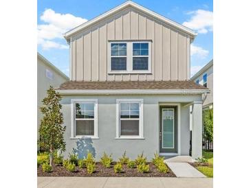 Charming two-story home with a well-manicured lawn and inviting entryway at 2019 Wild Heron Ct, Valrico, FL 33596