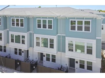 Charming townhome exterior showcases a two-story design with inviting curb appeal at 2123 1St N Ave, St Petersburg, FL 33713