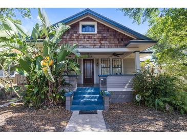 Charming craftsman-style home featuring a covered front porch and vibrant landscaping for enhanced curb appeal at 2435 4Th N Ave, St Petersburg, FL 33713