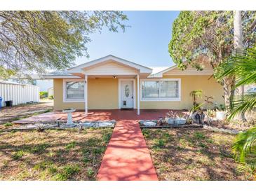 Charming single-story home featuring a well-maintained front yard and inviting entrance at 3823 N 56Th St, Tampa, FL 33619