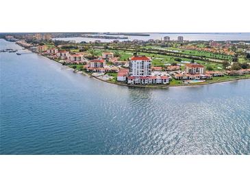 Stunning aerial view of waterfront condos, golf course, and serene blue water at 6265 Sun Blvd # 805, St Petersburg, FL 33715