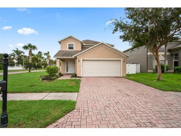 Charming two-story home with brick driveway and well-manicured lawn under a sunny blue sky at 1506 Lenton Rose Ct, Trinity, FL 34655