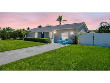 Charming single-story home with a well-manicured lawn and inviting curb appeal at 1011 Coldstream Ct, Tarpon Springs, FL 34689
