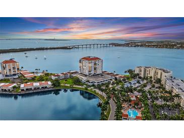 Stunning aerial view of Bahia Point condos on Siesta Key, Florida, with waterfront views and a picturesque sunset at 6287 Bahia Del Mar Cir # 404, St Petersburg, FL 33715