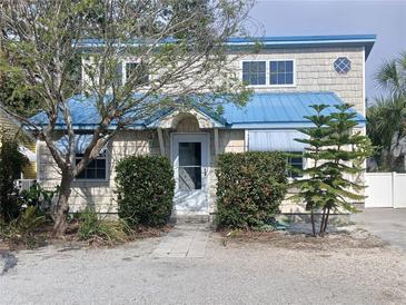 Charming coastal home with blue accents, landscaped yard, and cozy curb appeal at 2728 58Th S St, Gulfport, FL 33707