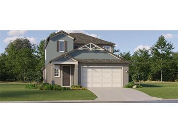 Charming two-story home featuring a gray trim, a well-manicured lawn, and a two-car garage at 11554 71St E Ave, Palmetto, FL 34221