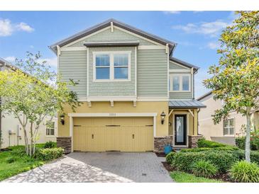 Charming two-story home showcasing well-manicured landscaping and a welcoming facade at 3303 Monroe Meadows Dr, Odessa, FL 33556