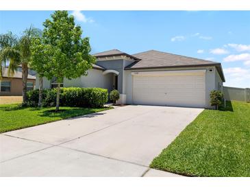 Beautiful single Gathering home featuring a two car garage, manicured lawn, and freshly painted exterior in a desirable neighborhood at 5208 Dandelion St, Apollo Beach, FL 33572