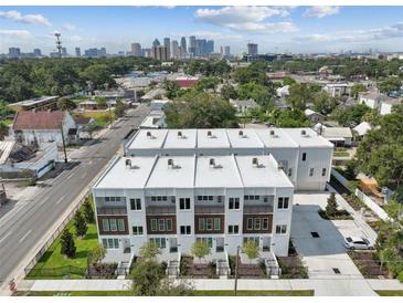 New modern townhomes boast a sleek design with cityscape views and convenient urban living at 121 E Warren Ave # 1, Tampa, FL 33602