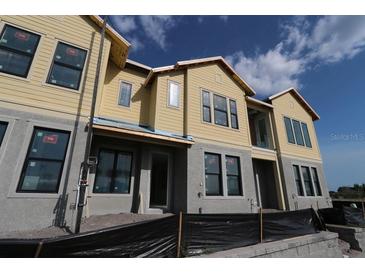 New construction townhome featuring a two-story design with modern architectural details at 1643 Springwell Ln, Sarasota, FL 34240