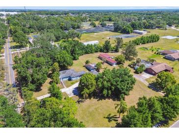 Sprawling property featuring a charming home, lush landscaping, and ample space at 101 N Taylor Rd, Seffner, FL 33584