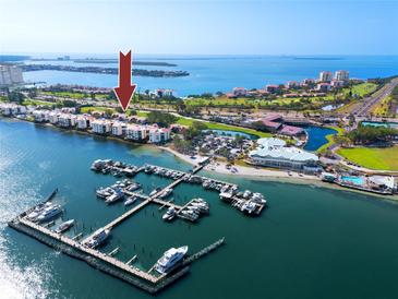 Picturesque aerial showcasing the waterfront condos, marina, and bay, creating a vibrant community atmosphere at 5736 La Puerta Del Sol S Blvd # 254, St Petersburg, FL 33715