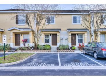 Charming townhouse exterior featuring reserved parking and well-maintained landscaping at 8531 Trail Wind Dr, Tampa, FL 33647