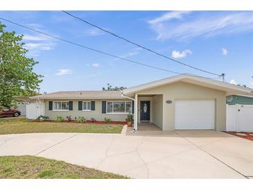 Charming single-story home with attached garage, well-maintained lawn, and inviting curb appeal at 14330 Oliver St, Largo, FL 33774