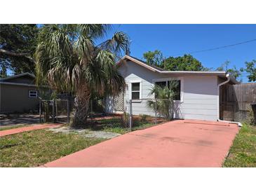 Charming single-story home featuring a small yard and mature trees, perfect for relaxed living at 342 N 40Th N St, St Petersburg, FL 33713