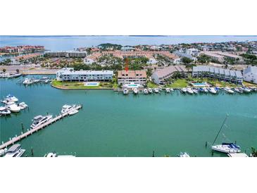 Waterfront condo with boat docks and pool offers stunning coastal living at 350 Pinellas Bayway S # 7, Tierra Verde, FL 33715