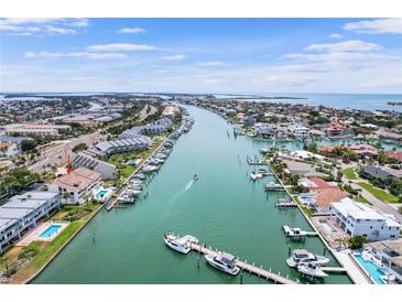 Aerial view of canal homes with boat docks and waterfront access at 350 Pinellas Bayway S # 7, Tierra Verde, FL 33715