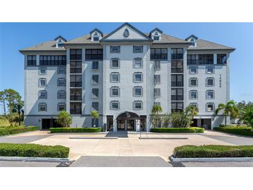 Beautiful five-story condo building with elegant architecture and a well-maintained entrance in a desirable community at 14820 Rue De Bayonne # 208, Clearwater, FL 33762