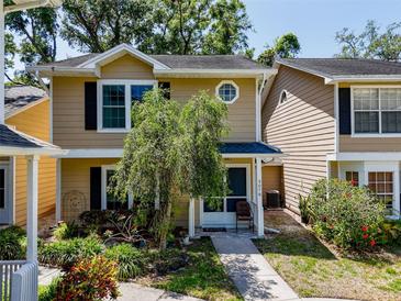 Charming two-story home with a well-maintained front yard and inviting entrance at 3078 Pointer Dr, Palm Harbor, FL 34683