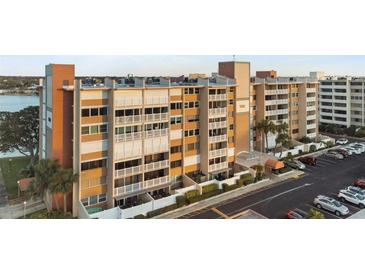 A beautiful condo building featuring covered parking and waterfront views at 500 Treasure Island Cswy # 704, Treasure Island, FL 33706