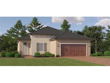 Charming single-story home features a brick driveway, a two-car garage, and lush landscaping at 31781 Griffin Sands Ln, San Antonio, FL 33576