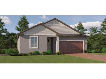 Charming single-story home featuring a welcoming entrance, two-car garage, and well-maintained landscaping at 11845 Sparkling Topaz Cv, Parrish, FL 34219