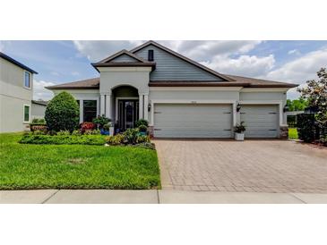 Charming single-story home boasts a three-car garage and professional landscaping at 2826 Riders Pass, Odessa, FL 33556
