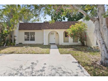 Charming single-story home featuring a welcoming entrance and mature landscaping at 9922 86Th Way, Seminole, FL 33777