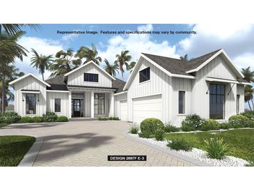 Stunning single-Gathering home with modern farmhouse design, manicured landscaping, and a paved driveway at 19453 Sheltered Hill Dr, Brooksville, FL 34601