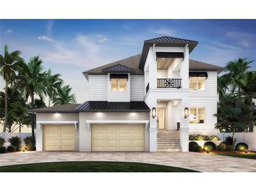 Beautiful new construction home with a light exterior, two car garage, second story balcony, and manicured landscaping at 4 W Spanish Main St, Tampa, FL 33609