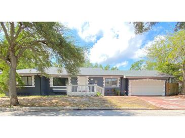 Charming single-story home with a well-maintained front yard and a quaint, covered front porch at 2400 13Th S Ave, St Petersburg, FL 33712