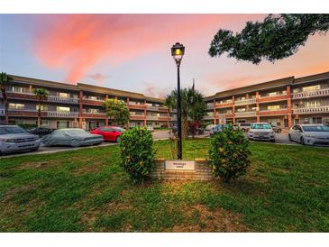 Charming condo complex with lush landscaping and ample parking at 2460 Persian Dr # 54, Clearwater, FL 33763