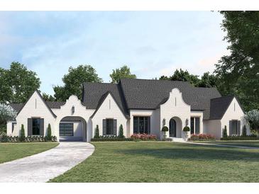 A charming single-story home boasts white brick, elegant archways, dark shutters, and a meticulously manicured lawn at 511 Avonwood, Tampa, FL 33625