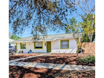 Charming one story home with a white exterior and a well manicured lawn at 6325 9Th S Ave, Gulfport, FL 33707