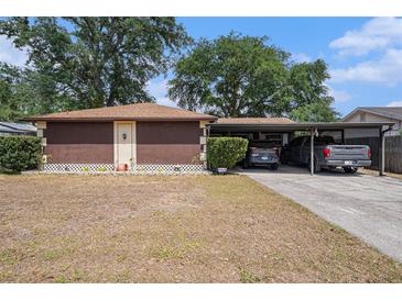 Single-story home featuring a carport and simple landscaping at 616 Highview S Cir, Brandon, FL 33510