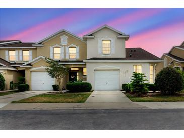 Charming two-story home boasts a well-maintained lawn and attached two-car garage at 6260 Olivedale Dr, Riverview, FL 33578