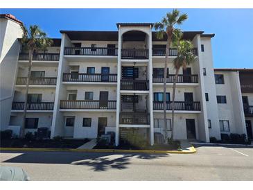 Beautiful condo with multiple stories, balconies, mature landscaping, and ample parking at 1624 Stickney Point Rd # 24-101, Sarasota, FL 34231