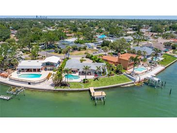 Waterfront home with a pool and dock provides direct access to the bay at 2788 70Th S Ave, St Petersburg, FL 33712