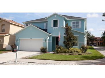 Charming two-story home with manicured lawn and attached garage at 7120 Early Gold Ln, Riverview, FL 33578